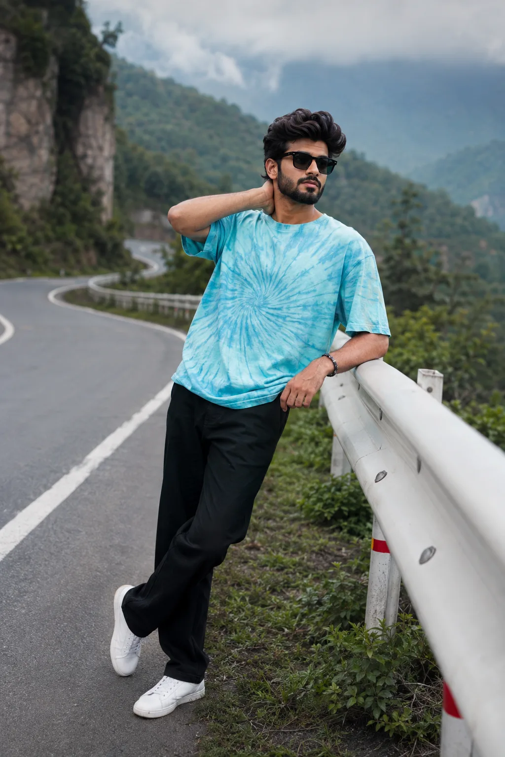 Stylish Young Man in Casual Streetwear on a Scenic Mountain Road